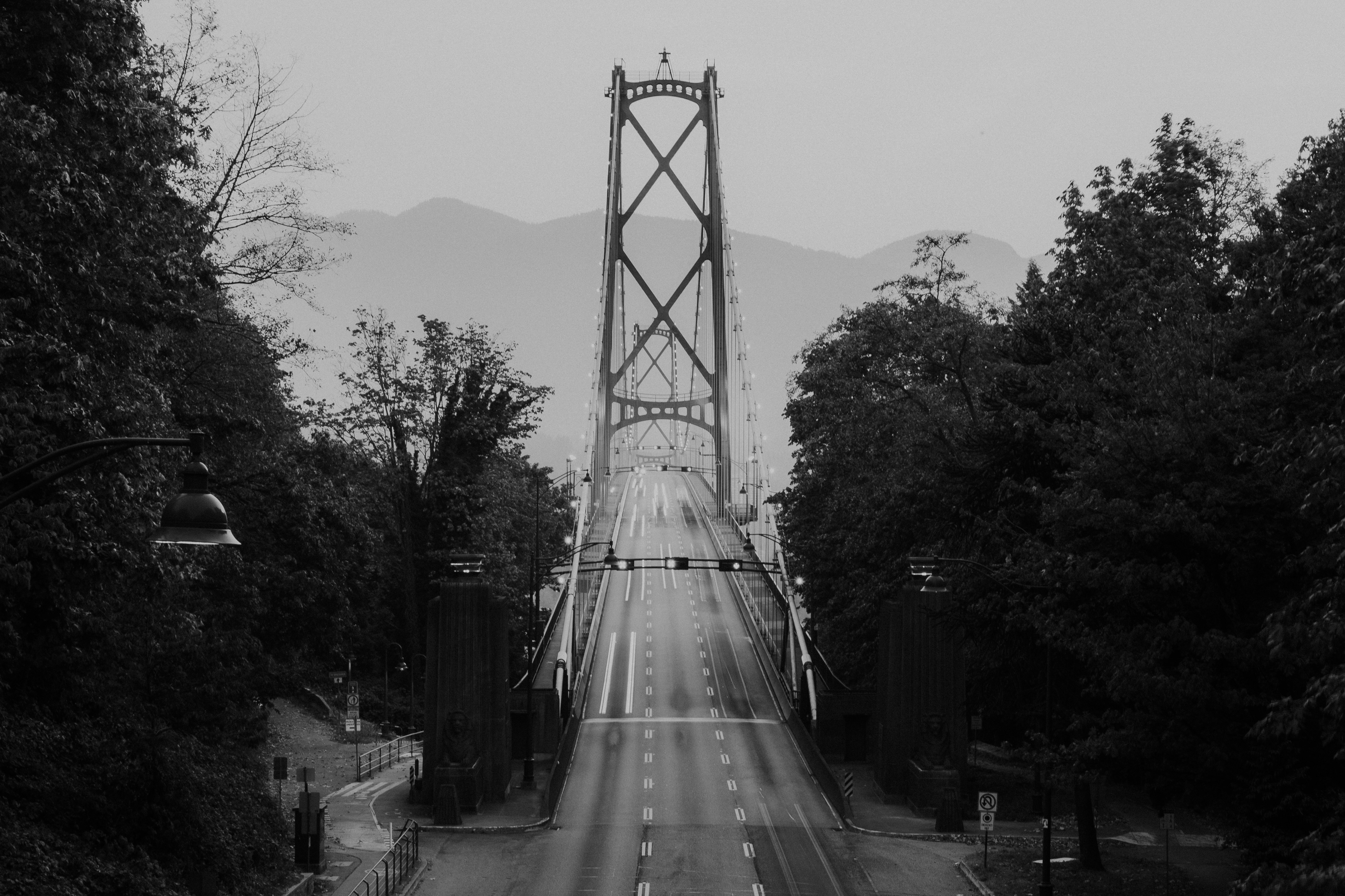 grayscale photography of suspension bridge